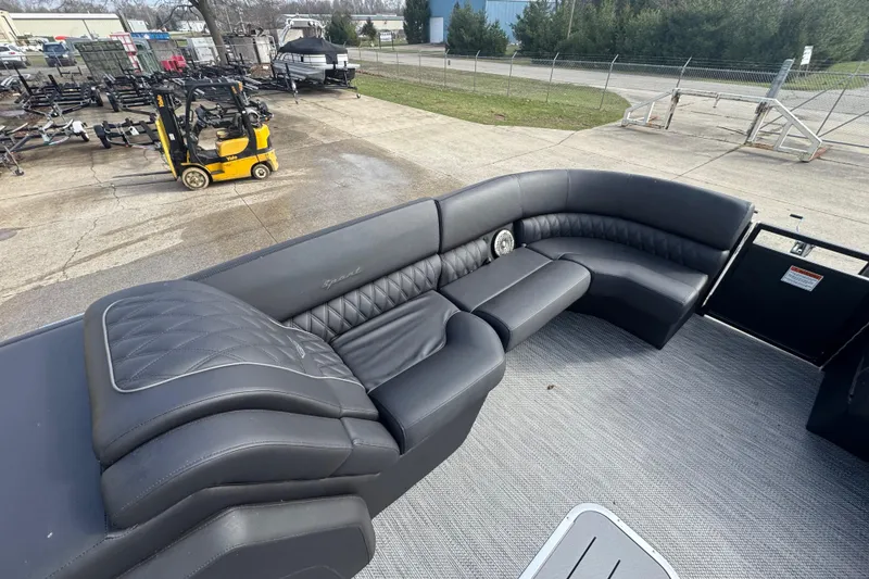 Slide: The Image of Luxurious seating on 2023 Bennington 30 QXFBAX2 pontoon boat, featuring sleek black upholstery. - 13