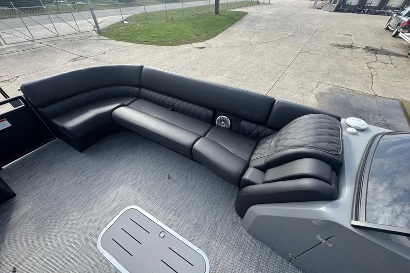 Slide: The Image of Luxurious seating on 2023 Bennington 30 QXFBAX2 pontoon boat, featuring sleek black upholstery. - 14