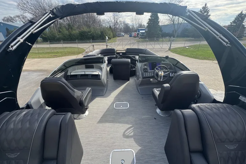 Slide: The Image of Luxurious 2023 Bennington 30 QXFBAX2 boat interior with modern seating and steering console. - 17