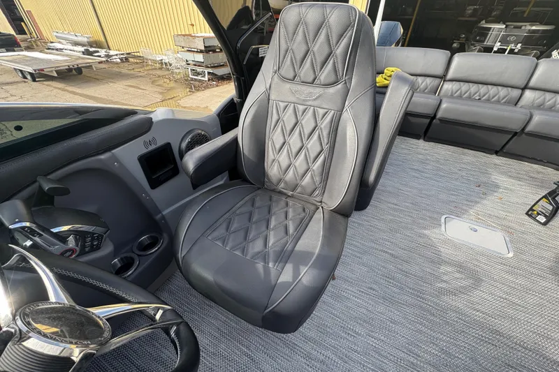 Slide: The Image of Luxurious interior of 2023 Bennington 30 QXFBAX2 boat with plush seating and modern controls. - 19