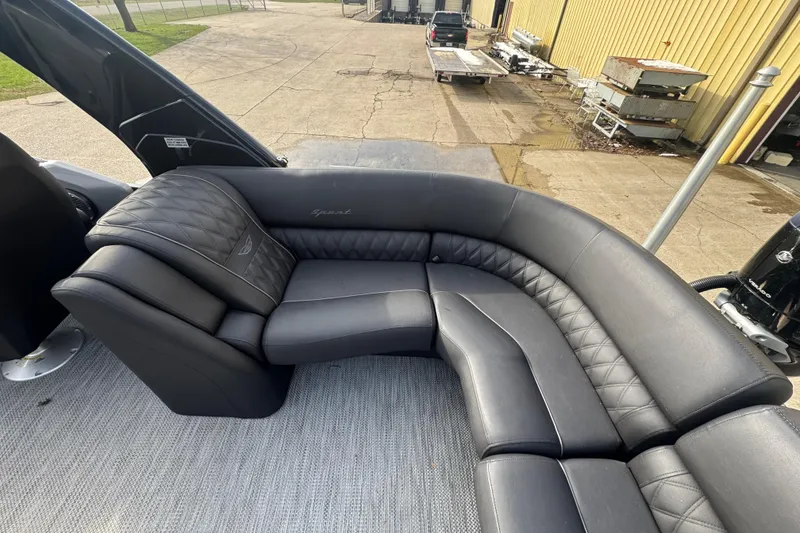 Slide: The Image of Luxurious seating on 2023 Bennington 30 QXFBAX2 pontoon boat, featuring elegant black upholstery. - 27