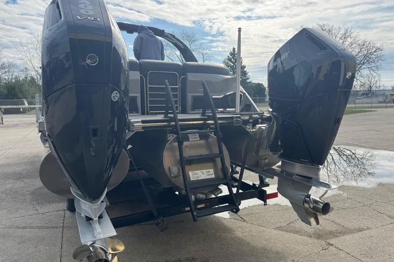 Slide: The Image of 2023 Bennington 30 QXFBAX2 boat with dual outboard motors on a trailer. - 36