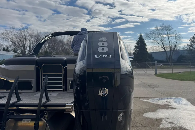 Slide: The Image of 2023 Bennington 30 QXFBAX2 boat with powerful 400 V10 engine, parked outdoors. - 39