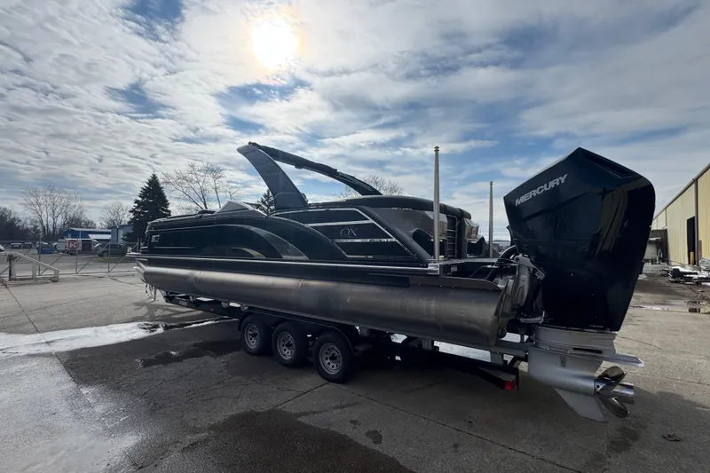 Slide: The Image of 2023 Bennington 30 QXFBAX2 pontoon boat with Mercury engine on trailer. - 8