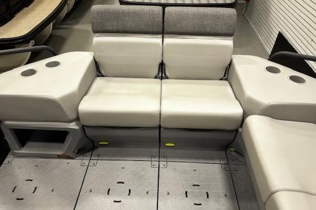 Slide: The Image of 2022 Sea-Doo Switch Cruise 21 interior seating with cup holders and storage. - 12