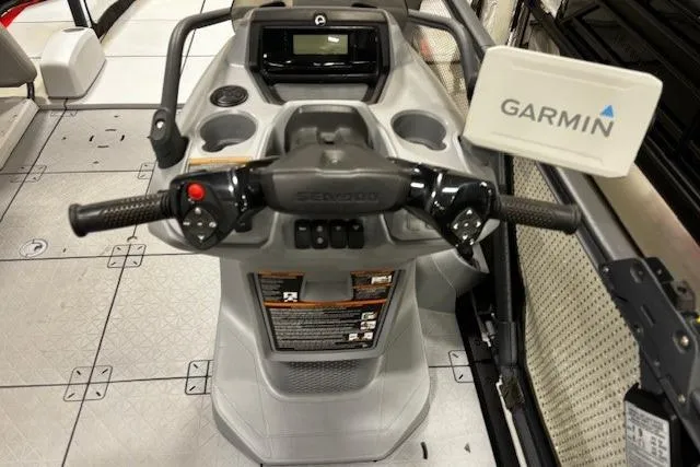 Slide: The Image of 2022 Sea-Doo Switch Cruise 21 dashboard with Garmin navigation system and controls. - 19