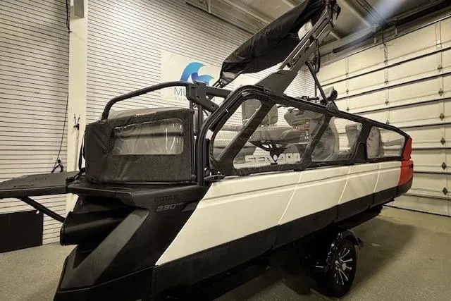Slide: The Image of 2022 Sea-Doo Switch Cruise 21 pontoon boat in a showroom, showcasing sleek design and features. - 2