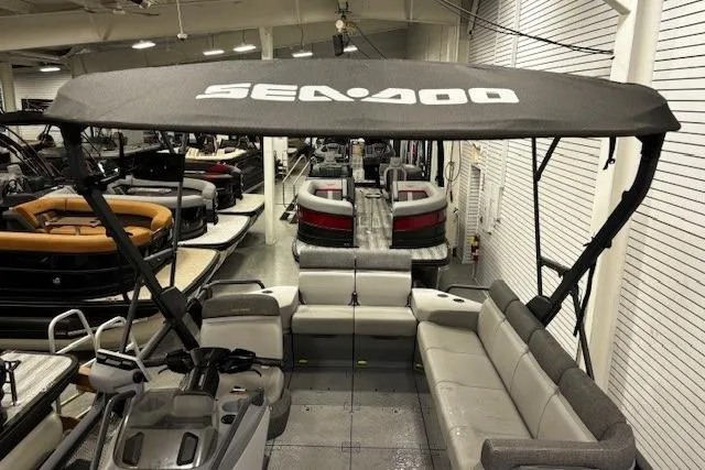 Slide: The Image of 2022 Sea-Doo Switch Cruise 21 pontoon boat with canopy in showroom. - 23
