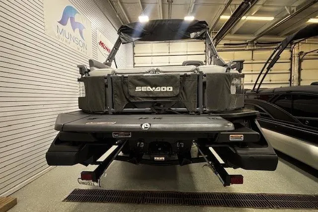 Slide: The Image of 2022 Sea-Doo Switch Cruise 21 in showroom, rear view with branding visible. - 30