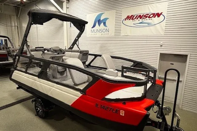 Slide: The Image of 2022 Sea-Doo Switch Cruise 21 pontoon boat displayed indoors at Munson Ski & Marine. - 4