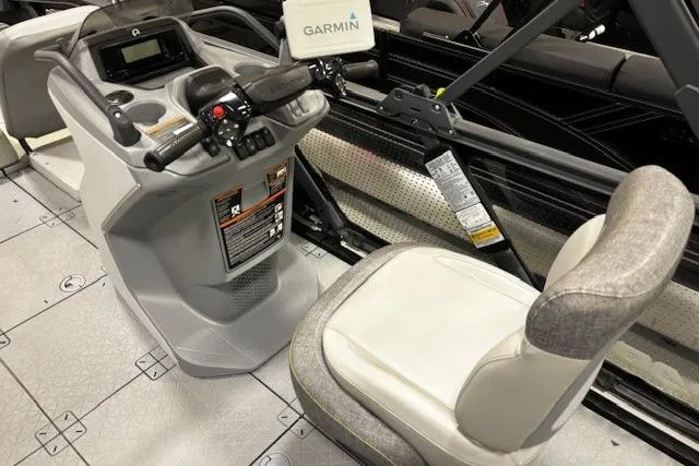 Slide: The Image of 2022 Sea-Doo Switch Cruise 21 cockpit with Garmin navigation system and comfortable seating. - 5