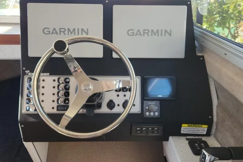 Slide: The Image of Helm of 2023 KingFisher 3025 Destination boat with Garmin navigation displays. - 13