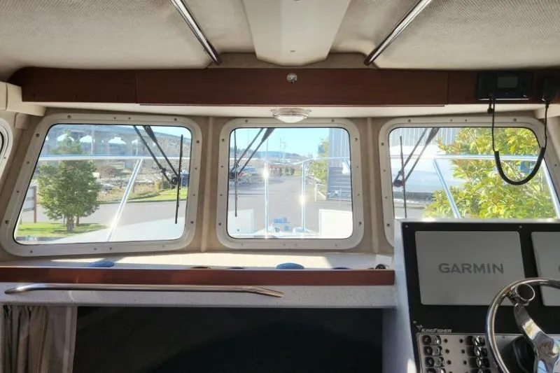 Slide: The Image of Interior view of 2023 KingFisher 3025 Destination boat with Garmin navigation system. - 15