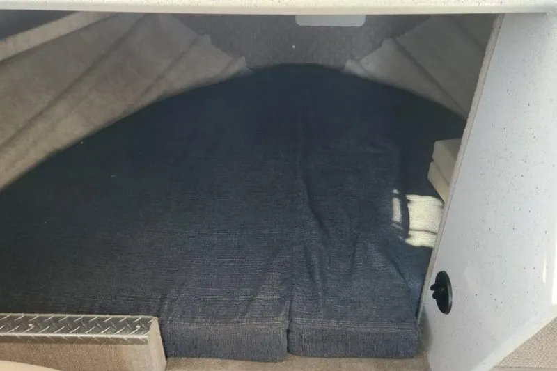 Slide: The Image of Interior cabin of 2023 KingFisher 3025 Destination boat, featuring a cozy sleeping area. - 16