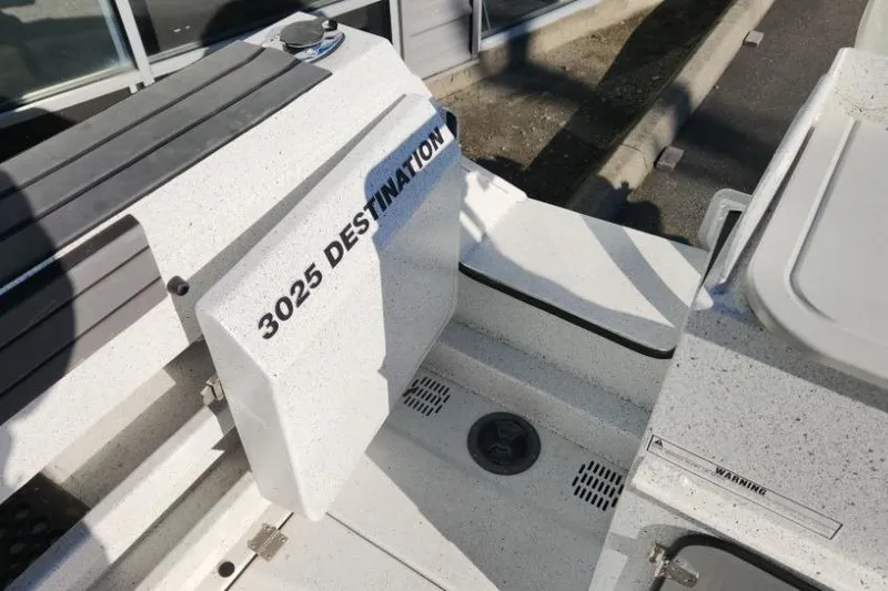 Slide: The Image of 2023 KingFisher 3025 Destination boat deck with seating and storage compartments. - 20