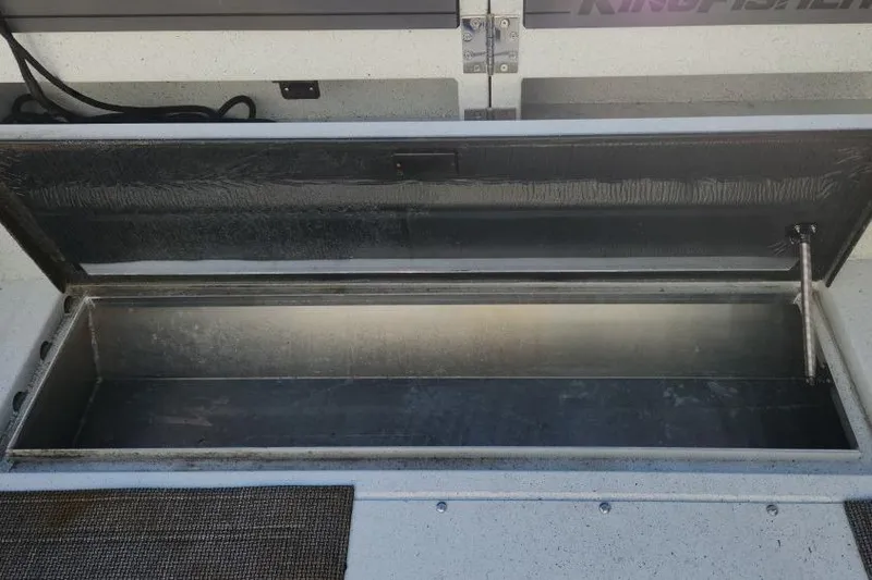Slide: The Image of Open storage compartment on 2023 KingFisher 3025 Destination boat. - 22