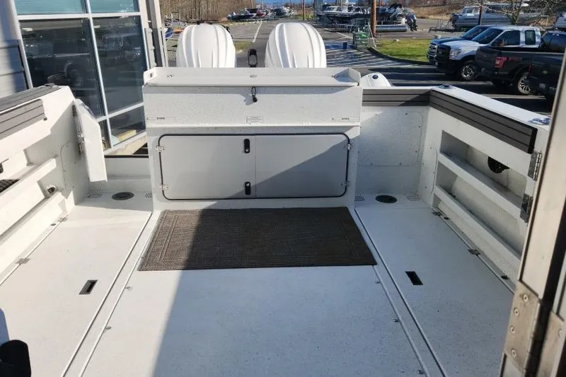 Slide: The Image of 2023 KingFisher 3025 Destination boat interior with storage compartments and seating. - 7