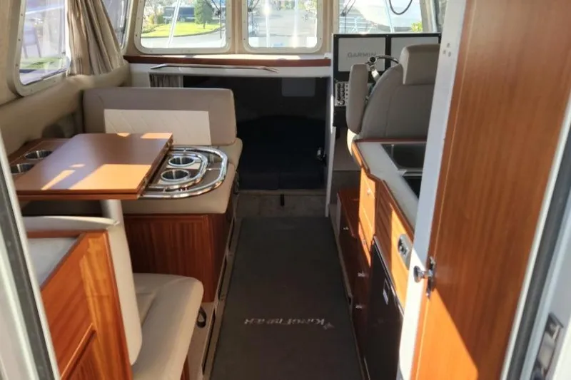 Slide: The Image of Interior of 2023 KingFisher 3025 Destination boat with seating and navigation area. - 9