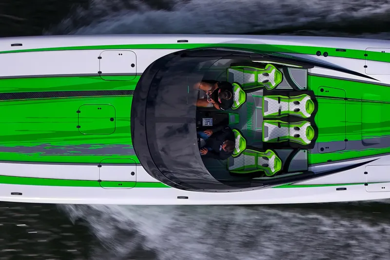 Slide: The Image of 2025 Performance Powerboats P360, aerial view, sleek design with vibrant green accents. - 11