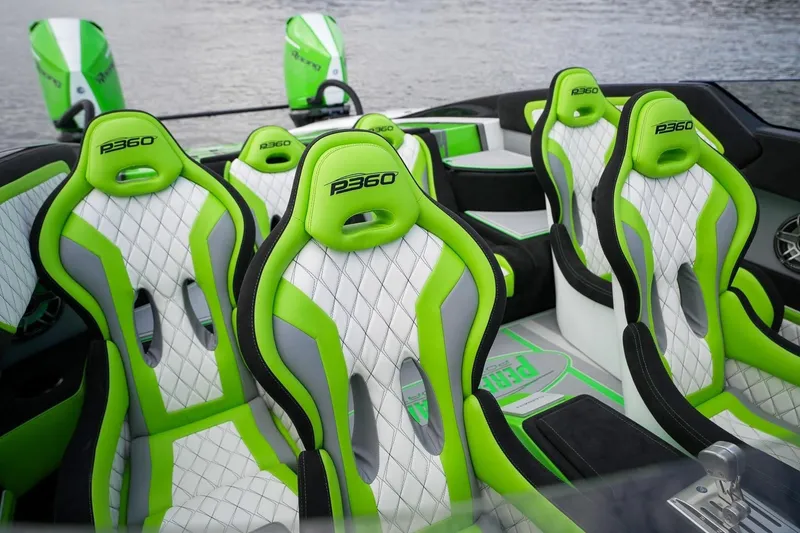 Slide: The Image of Interior of 2025 Performance Powerboats P360 with green and white seats. - 2