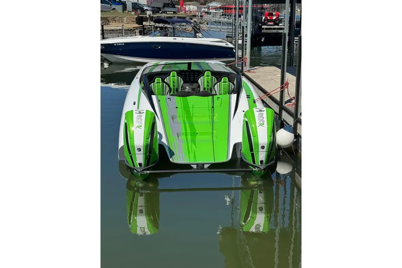 Slide: The Image of 2025 Performance Powerboats P360 in vibrant green and white docked at a marina. - 5