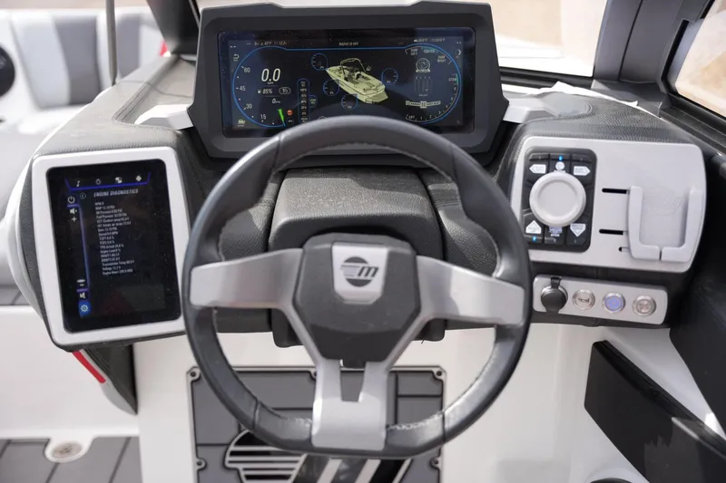 Slide: The Image of Dashboard of 2022 Malibu Wakesetter 23 MXZ with advanced controls and displays. - 10