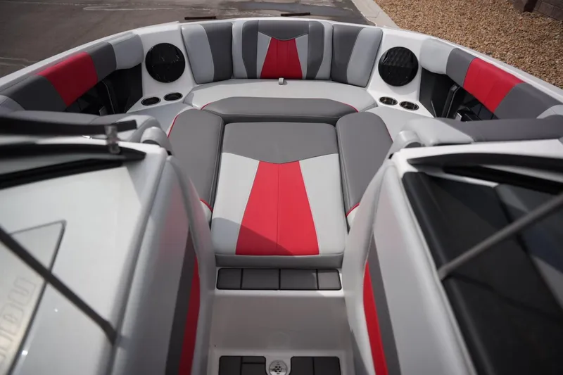 Slide: The Image of Interior of 2022 Malibu Wakesetter 23 MXZ boat with red and gray seating. - 8
