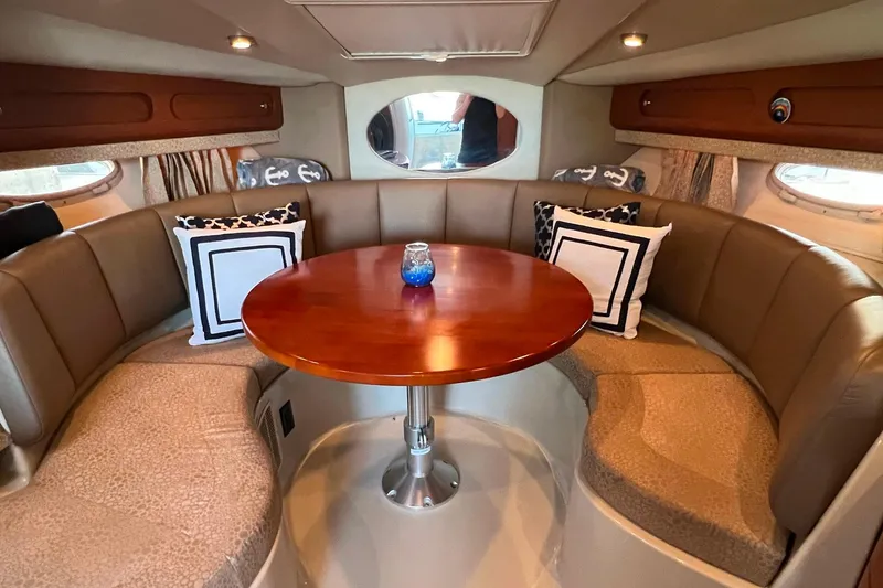 Slide: The Image of Luxurious interior of 2003 Chaparral Signature 320 yacht with elegant seating and table. - 7