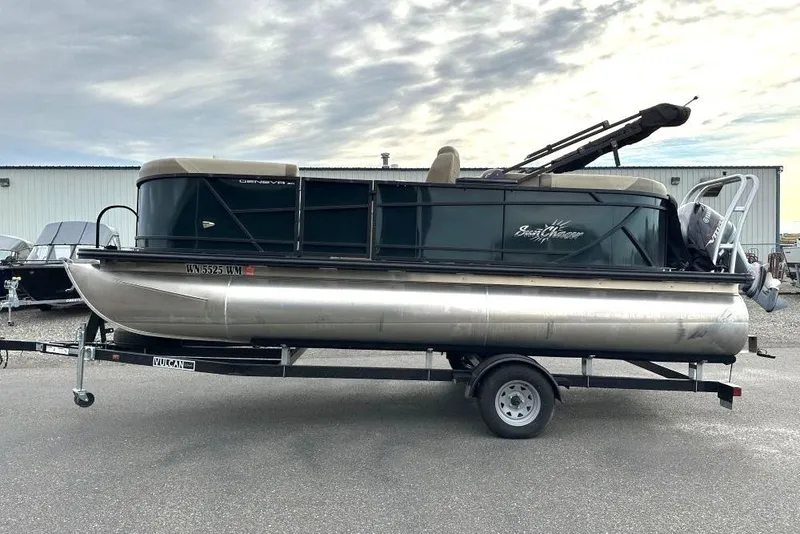 The Image of 2024 SunChaser Geneva Cruise 20 LR DH pontoon boat on trailer, parked outdoors. - 1
