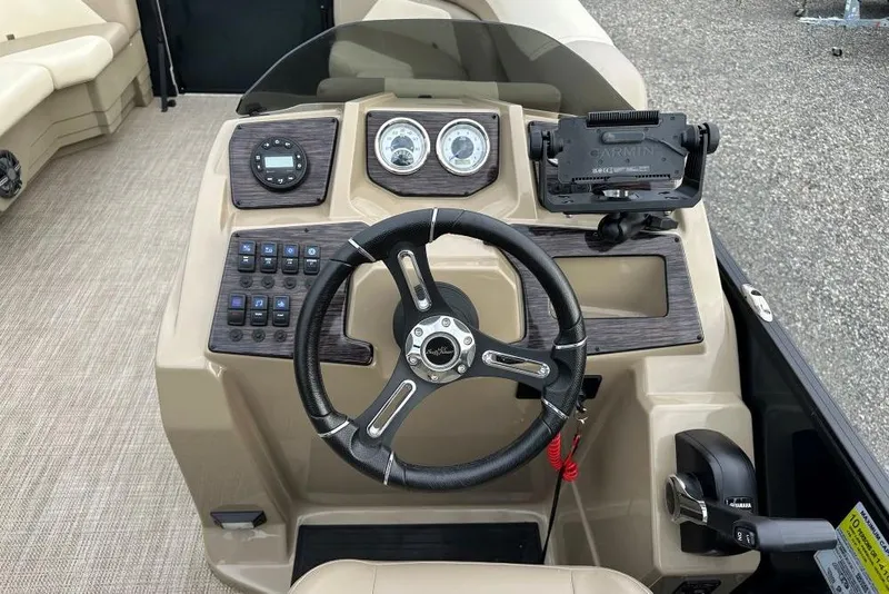 Slide: The Image of 2024 SunChaser Geneva Cruise 20 LR DH dashboard with steering wheel and controls. - 9