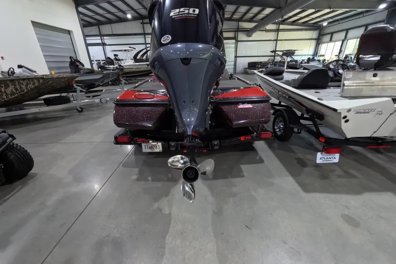 Slide: The Image of 2017 Skeeter FX20 boat in showroom, rear view with powerful engine. - 14