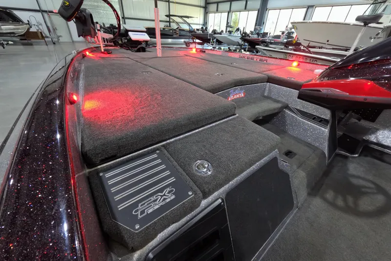 Slide: The Image of 2017 Skeeter FX20 boat interior with red LED lights and carpeted deck. - 5