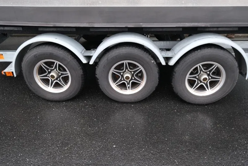 Slide: The Image of Triple axle trailer for 2024 Hewescraft 270 Pacific Explorer ET Hardtop. - 20