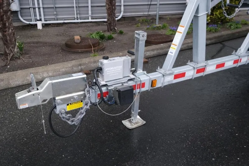 Slide: The Image of Trailer hitch and hydraulic brake system for 2024 Hewescraft 270 Pacific Explorer ET Hardtop. - 21