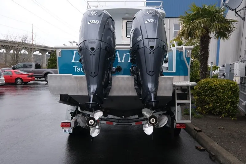 Slide: The Image of 2024 Hewescraft 270 Pacific Explorer ET Hardtop with dual Yamaha 200 engines, rear view. - 5