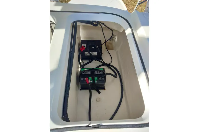 Slide: The Image of 2022 Bayliner VR6 Bowrider OB battery compartment with wiring and connections. - 20