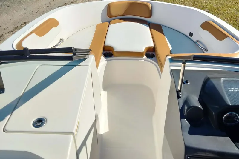 Slide: The Image of 2022 Bayliner VR6 Bowrider OB interior with tan and white seating. - 24