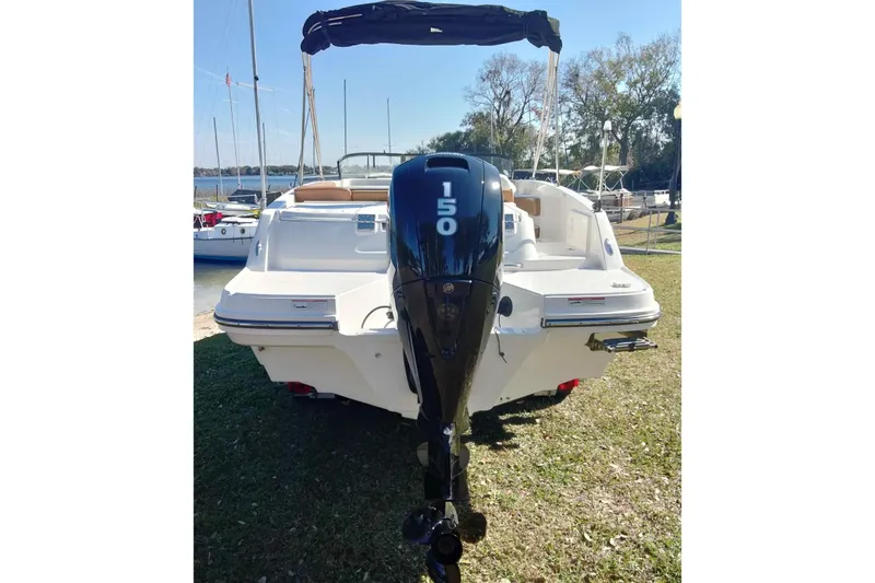 Slide: The Image of 2022 Bayliner VR6 Bowrider OB with 150 HP outboard motor, docked on grass. - 7