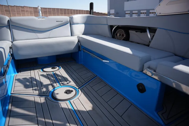 Slide: The Image of Interior of a 2021 MasterCraft XT25 boat with sleek seating and modern design. - 11