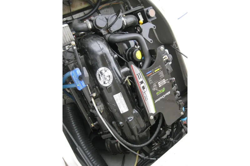 Slide: The Image of Engine of 2013 Bayliner 195 Discovery boat, featuring MerCruiser 3.0 MPI. - 18