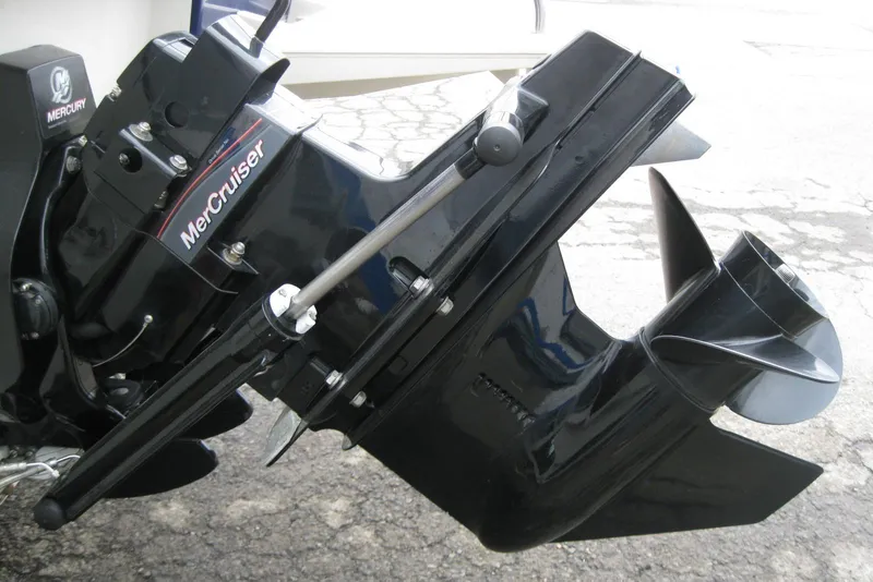 Slide: The Image of MerCruiser engine on 2013 Bayliner 195 Discovery boat, showcasing propeller and drive system. - 7