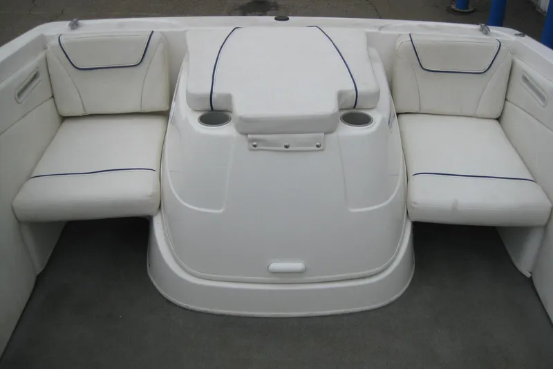Slide: The Image of Interior seating of a 2013 Bayliner 195 Discovery boat with white cushions. - 9
