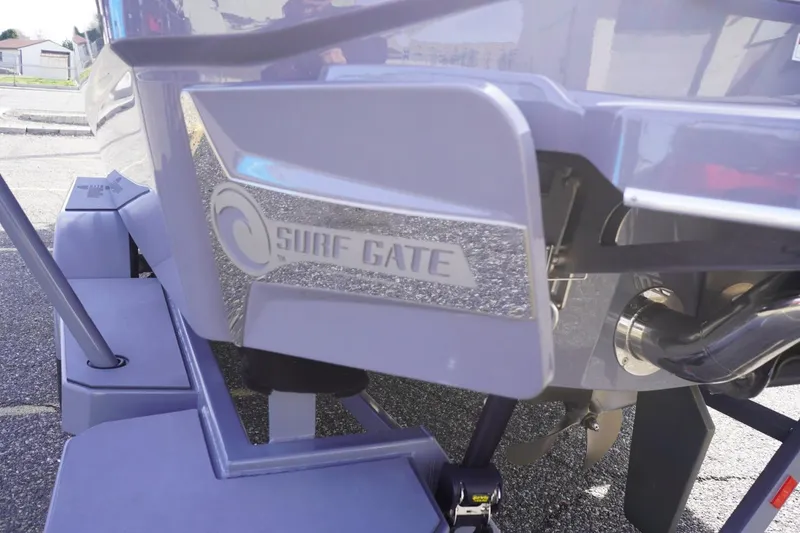 Slide: The Image of 2023 Malibu M220 boat with Surf Gate technology for enhanced wake surfing. - 11