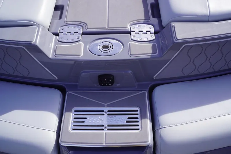 Slide: The Image of 2023 Malibu M220 boat interior with sleek seating and modern design elements. - 19