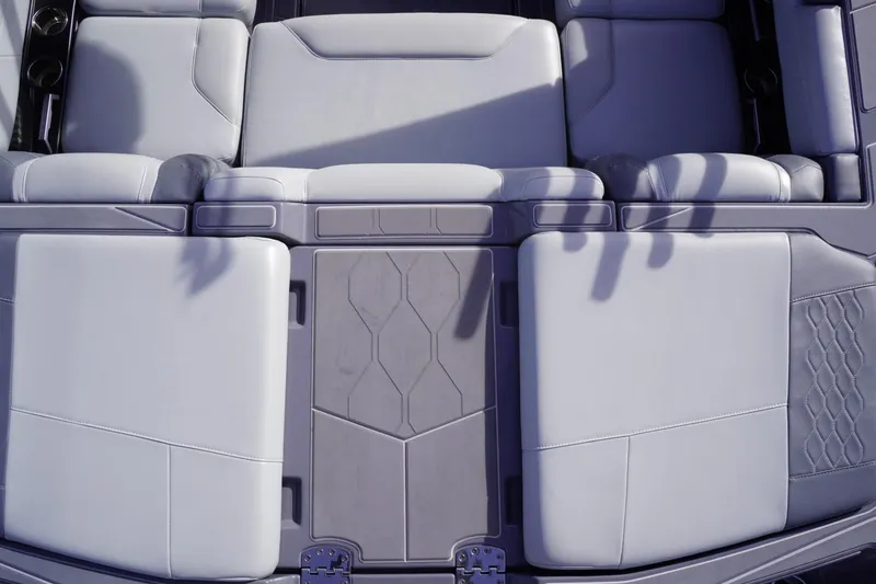 Slide: The Image of 2023 Malibu M220 boat interior with luxurious seating and modern design. - 26