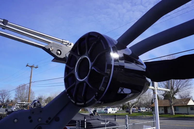 Slide: The Image of 2023 Malibu M220 boat tower speaker against a clear blue sky. - 31