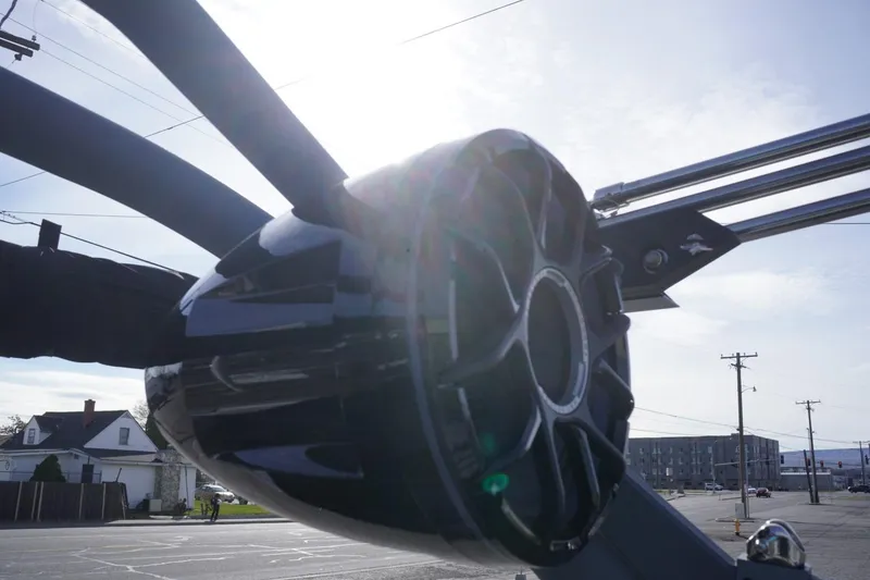 Slide: The Image of 2023 Malibu M220 boat speaker system in bright sunlight, showcasing sleek design. - 32