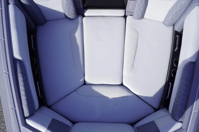 Slide: The Image of 2023 Malibu M220 boat interior with luxurious seating and quilted upholstery. - 39