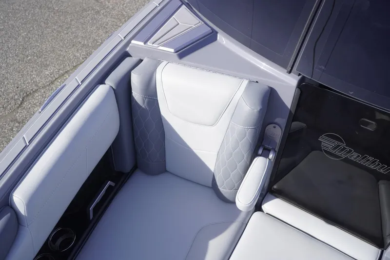 Slide: The Image of 2023 Malibu M220 boat interior with luxurious seating and sleek design. - 43
