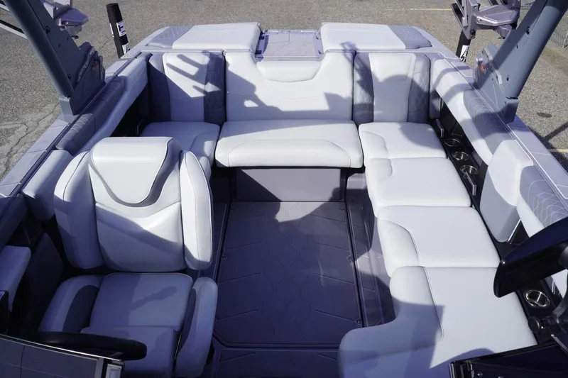 Slide: The Image of 2023 Malibu M220 boat interior with luxurious white seating and modern design. - 47